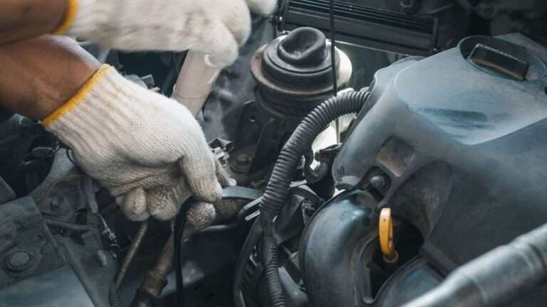 mechanic doing engine repair service at home.